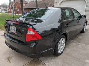 Detailed Ford car with a high-gloss exterior finish, showcasing spotless shine and smooth paintwork.