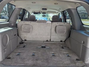 Interior exterior detailed SUV's cargo area, cleaned and shampooed to remove dust, dirt, and debris at Appleton Car Wash.