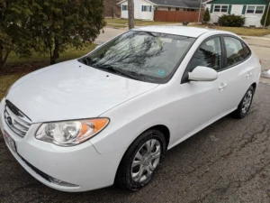 White car exterior after basic detailing with wax coating