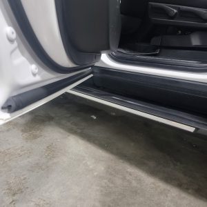 Detailed cleaning of door jambs in SUV at Appleton Car Wash