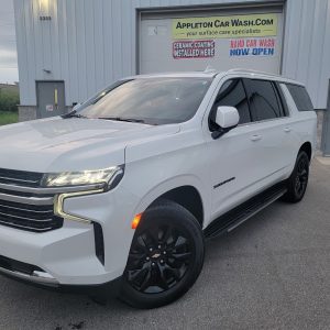 White SUV with enhanced exterior detailing at Appleton Car Wash