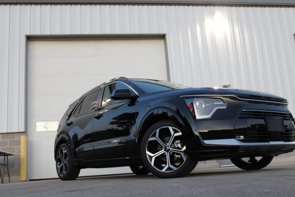 Vehicle gleaming with a high-gloss finish after a foam car wash and premium wax.