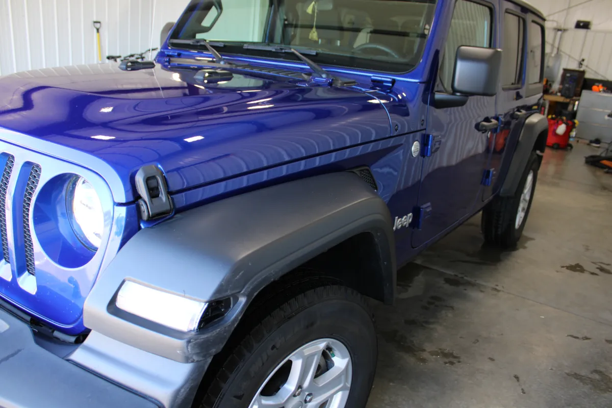 The premium exterior detailing at Appleton Car Wash for this Jeep Wrangler included a clay bar treatment, which eliminated road grime and left the paint looking sleek and smooth.