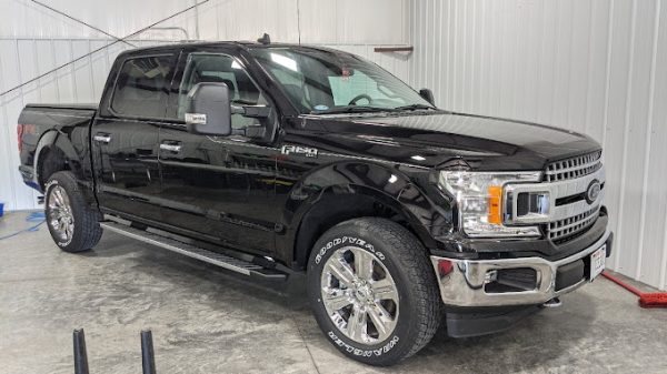 Exterior Detailing - Ceramic Coating: Black Ford F150 with professional ceramic coating, offering intense shine and lasting protection.
