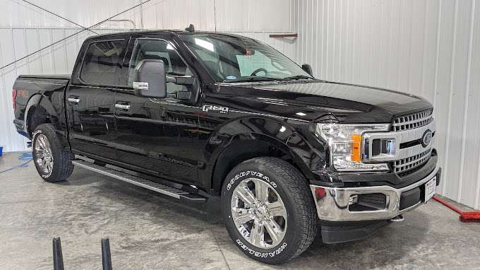 Exterior Detailing - Ceramic Coating: Black Ford F150 with professional ceramic coating, offering intense shine and lasting protection.
