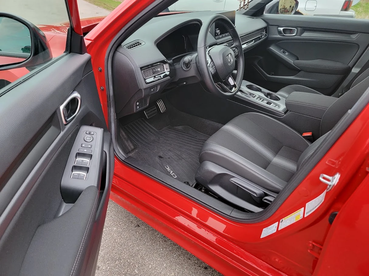 Full interior car detailing with vacuumed carpets, clean seats, and sanitized surfaces.